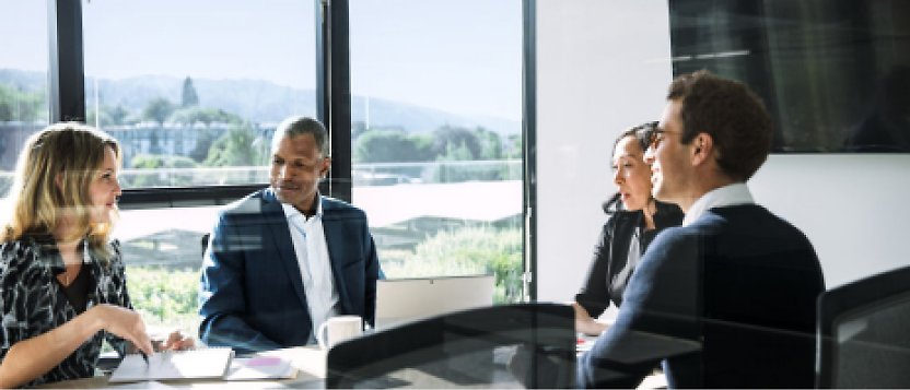 A group of business people having a meeting in a conference room.