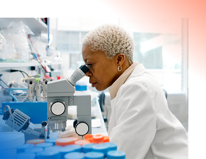 A person looking through a microscope