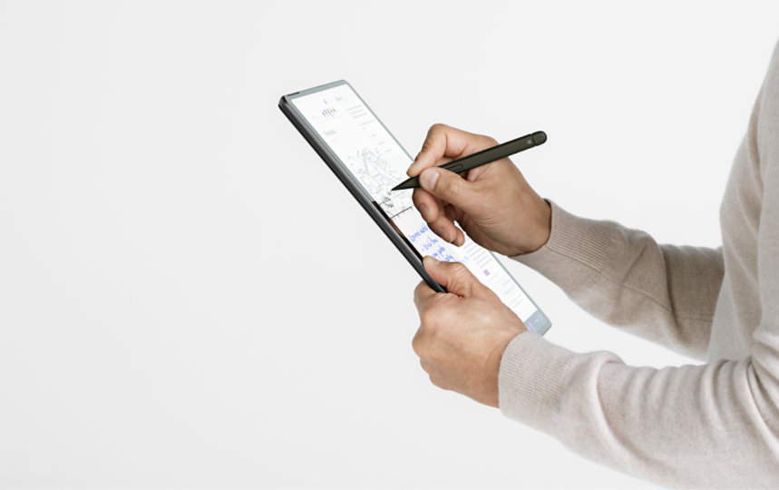 A person uses a Surface Pen to write on the touchscreen of a Surface Pro 10 for Business.