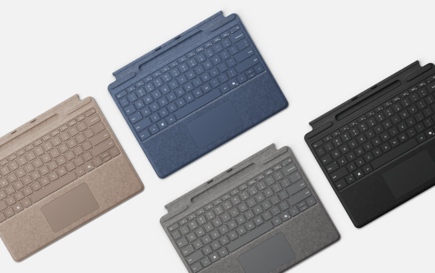 Cuatro Teclados para Surface Pro con almacenamiento de lápiz en una variedad de colores.