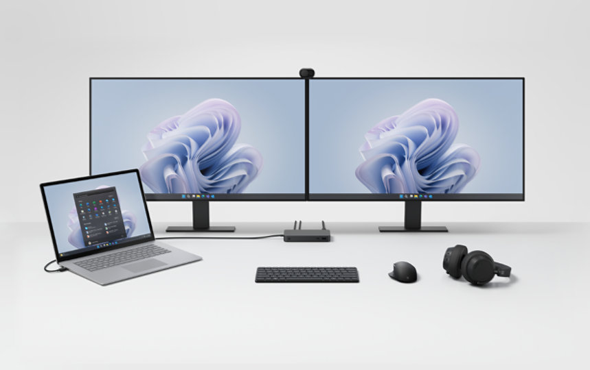 Ein Schreibtisch-Setup mit Surface Thunderbolt™ 4-Dock for Business, verbunden mit anderen Surface-Geräten und Zubehör. 