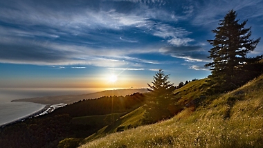 Expansive view of ocean coast at sunset across the foothills in Mount Tamalpais State Park, Mill Valley, California