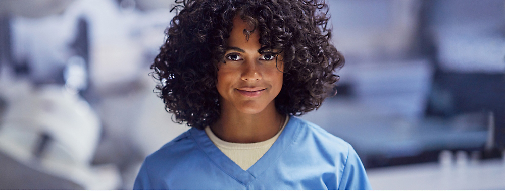 A close-up of a person with curly hair