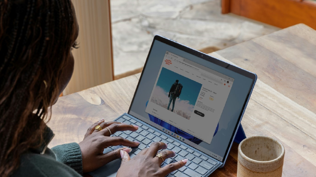 Female student working on a laptop at a table