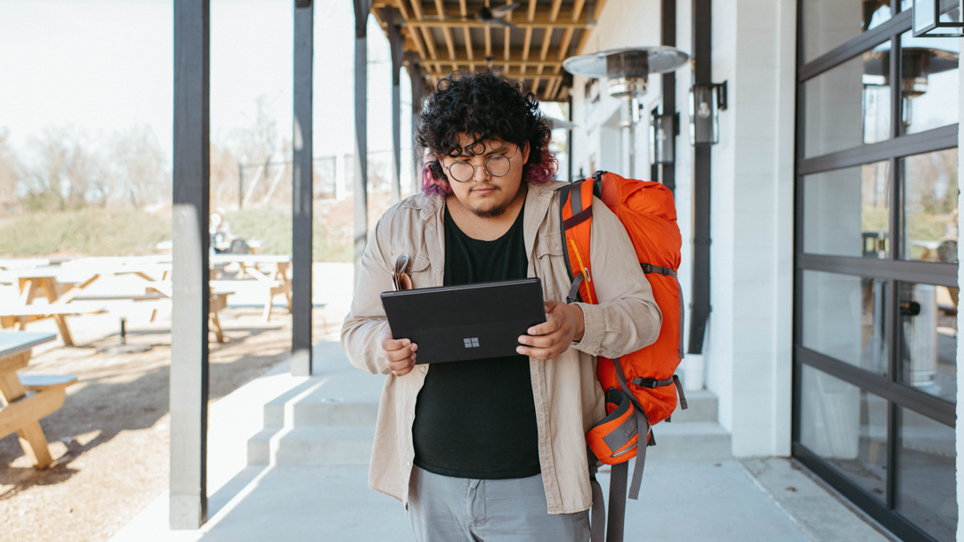 Man walking with Surface tablet