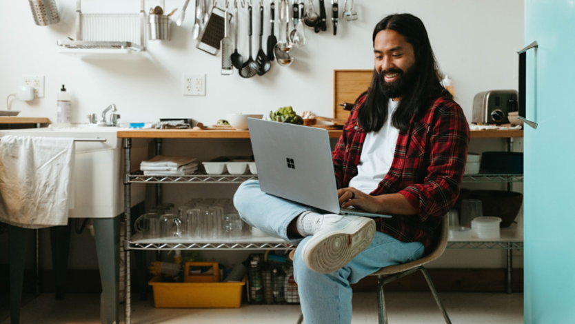 Man using Surface device in kitchen