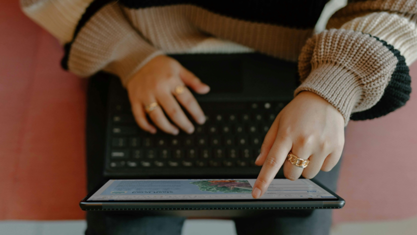 Person using a touchscreen laptop