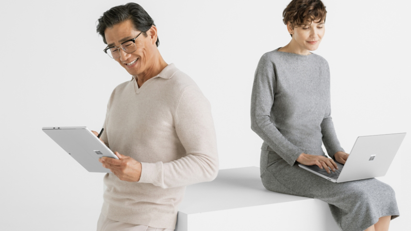 Man and woman working with Surface Laptop 6 in different device configurations of tablet and laptop