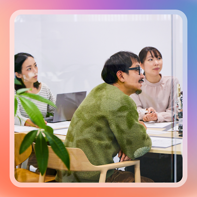 A group of people sitting at a table