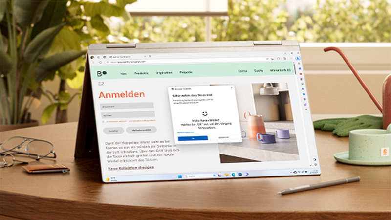 PC aufgeklappt mit Anmelde-Bildschirm