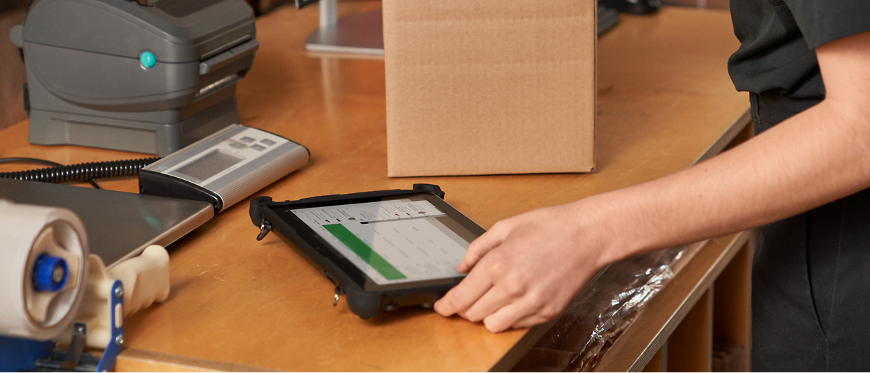 A person holding a tablet