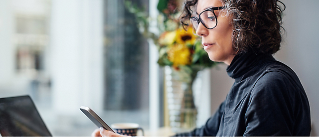 A person looking at a tablet