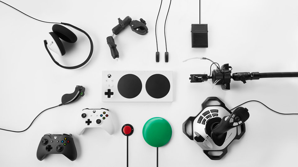 Xbox Adaptive Controller surrounded by compatible external devices.
