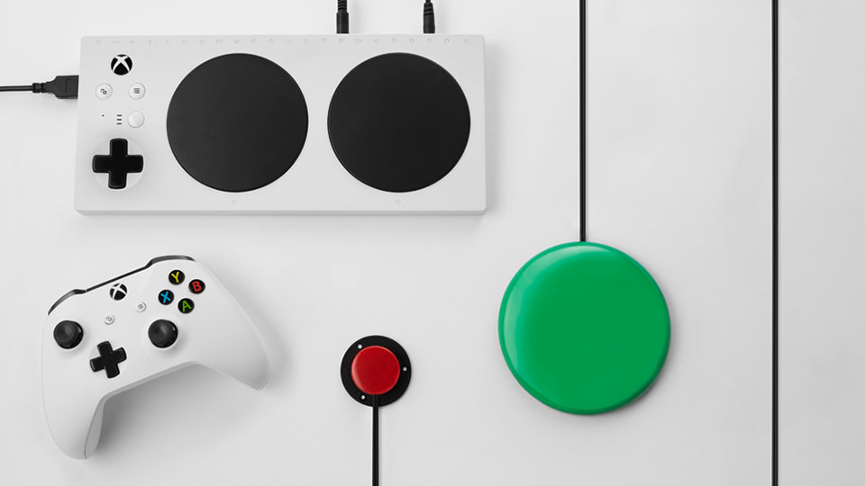 Xbox Adaptive Controller with external button, switch, and Xbox Wireless Controller.