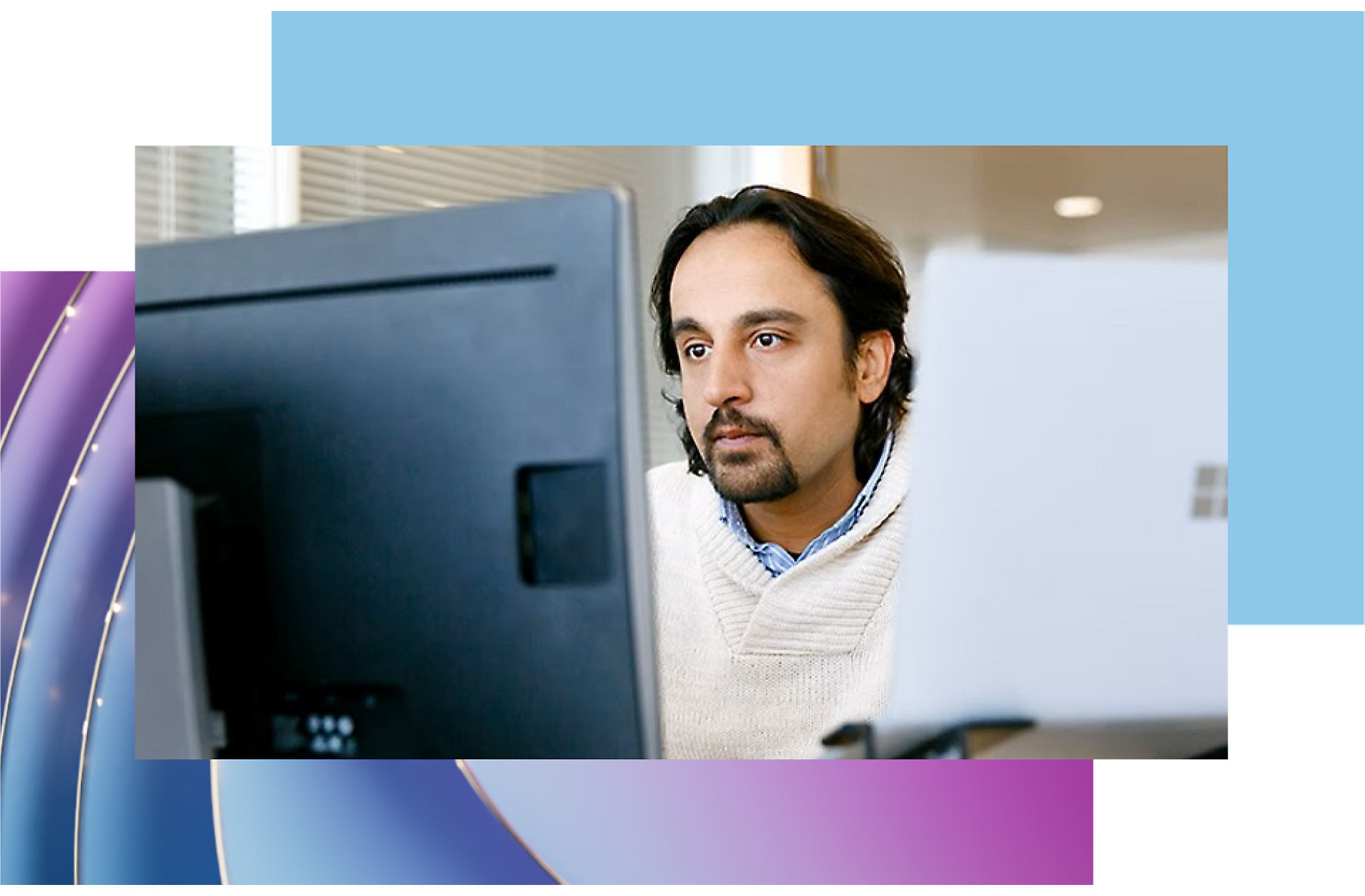 A man looking at a computer screen.