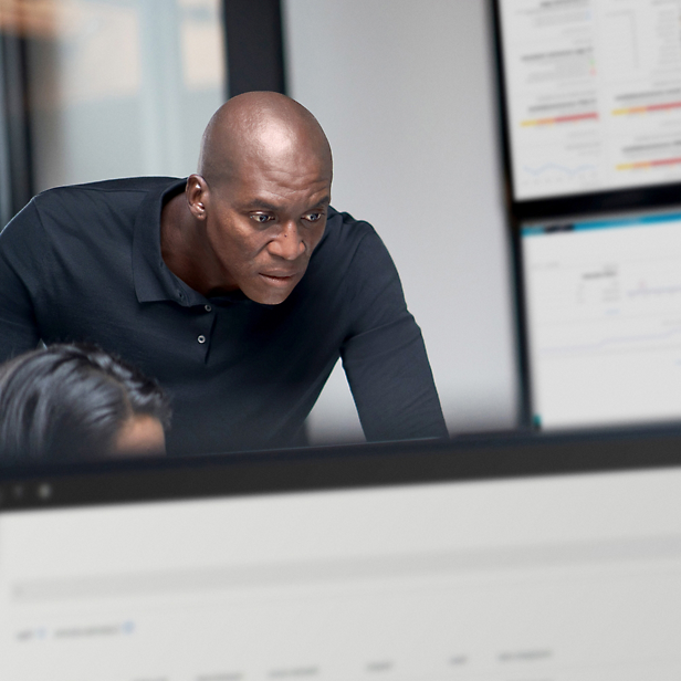 A man looking at a computer screen.