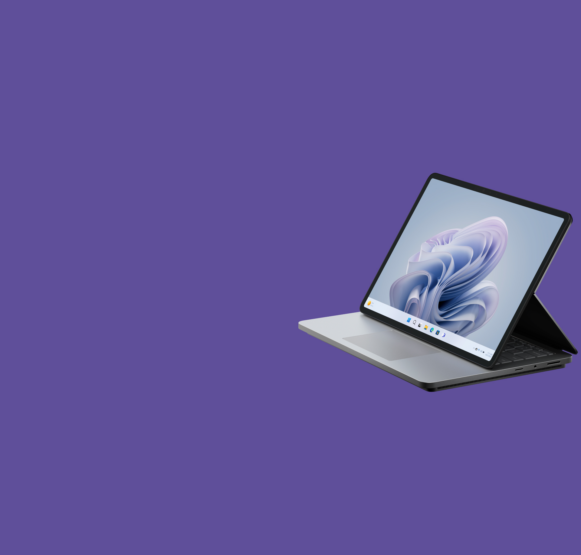 Ángulo lateral de Surface Laptop Studio 2 que muestra una flor de Windows en la pantalla.