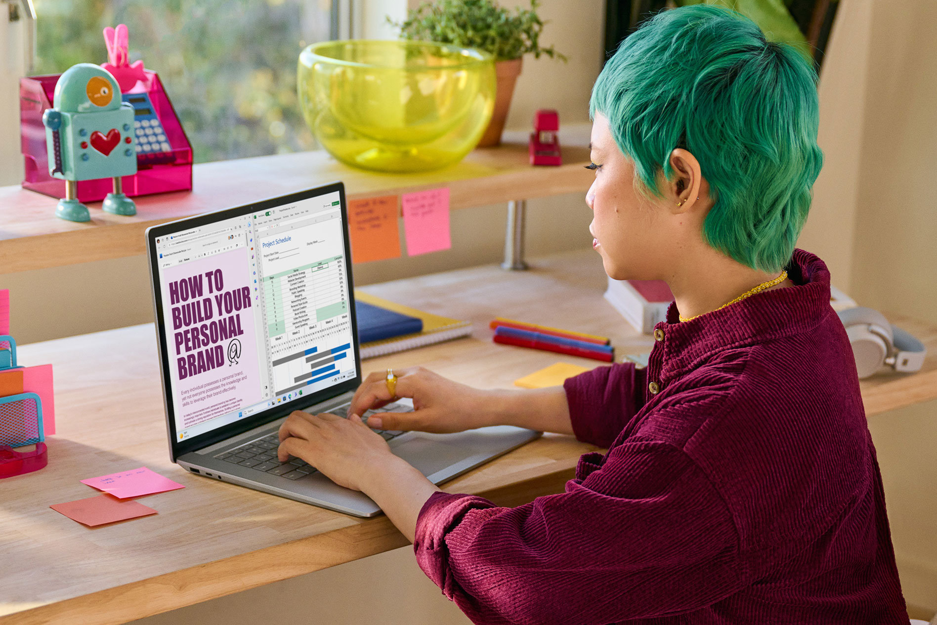 A young person works at their desk with multiple apps appearing on screen of their Surface Laptop 5.