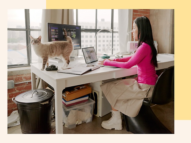 A person using a laptop at a desk