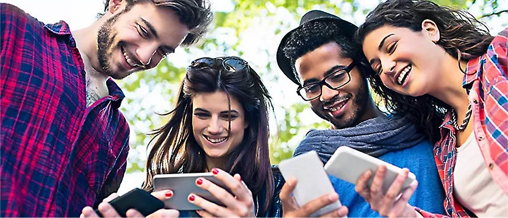 A group of people looking at phones