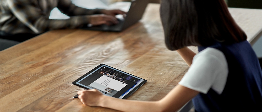 A woman using a tablet.