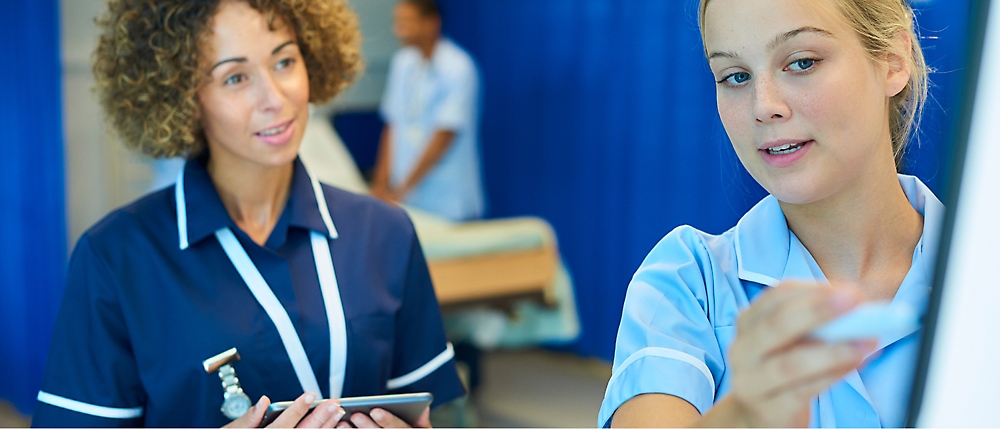 A few nurses in blue uniforms