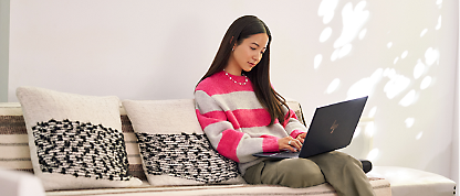 A girl is working with a laptop.