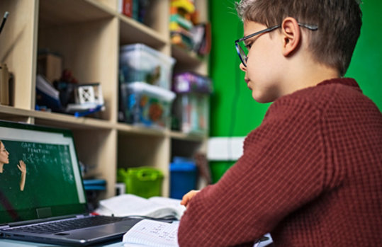 Young boy in remote math class