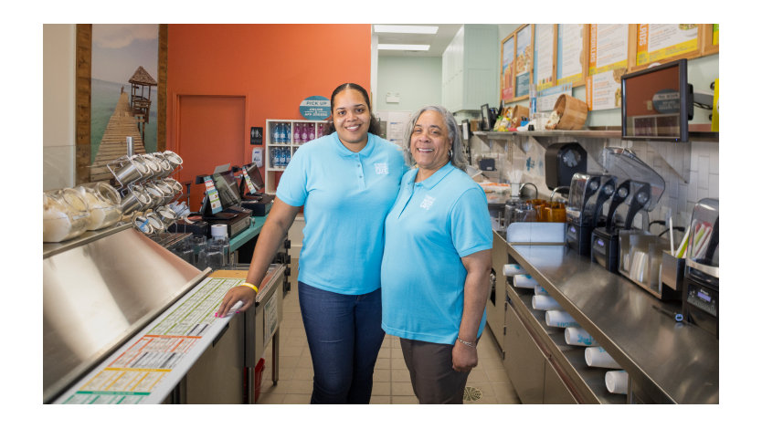 Ruth and Aisha Miller posing in restaurant. 