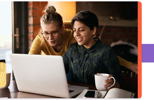 Adult and child looking at laptop together