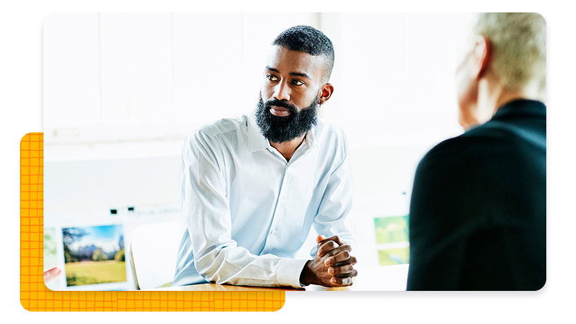 Man at a desk looking away