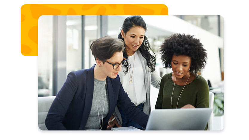 Three women looking at a laptop