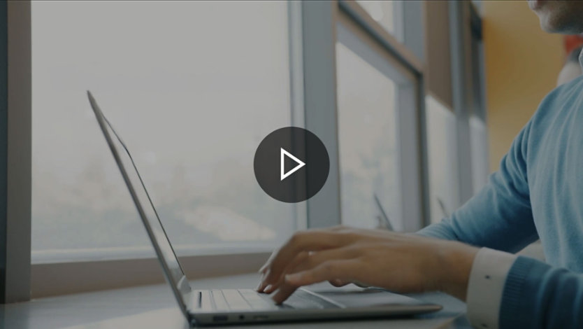 Person typing on a laptop keyboard