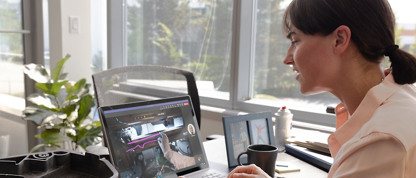 A woman looking at a computer screen