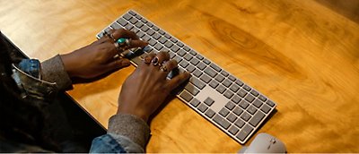 A person typing on a keyboard