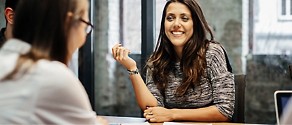 A group of people talking with smiling phase