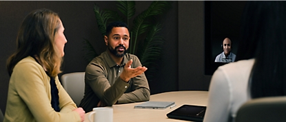 A group of people discussing in a conference room