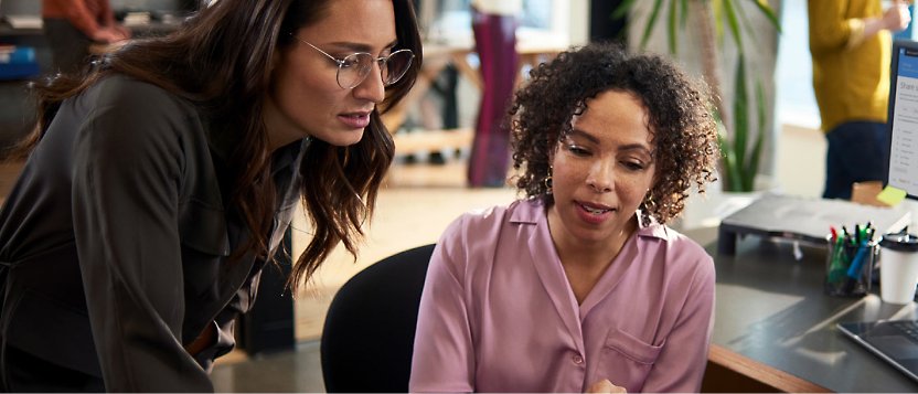 Two woman working in office