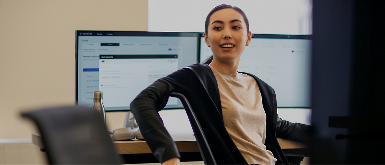 A person sitting in front of a computer