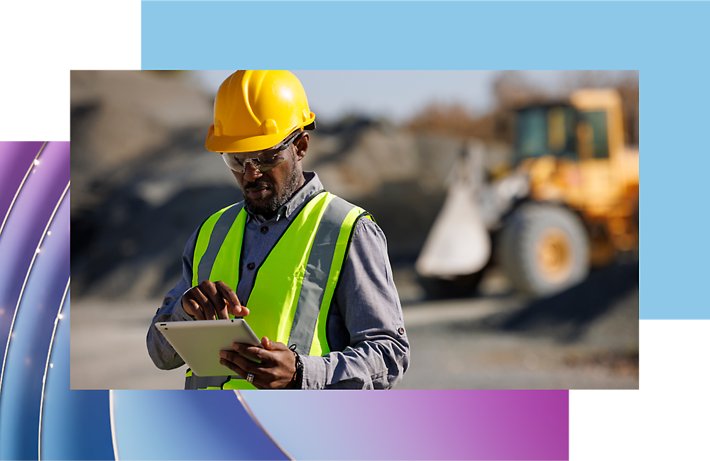 A person wearing a safety vest and hard hat