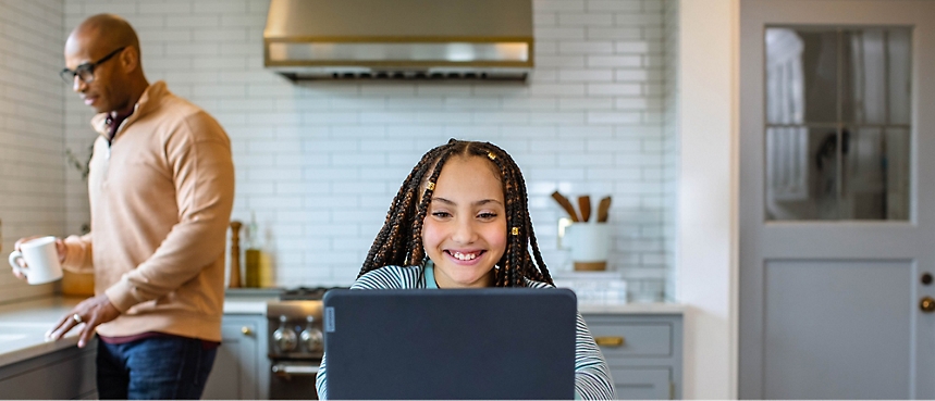 A person smiling at a computer