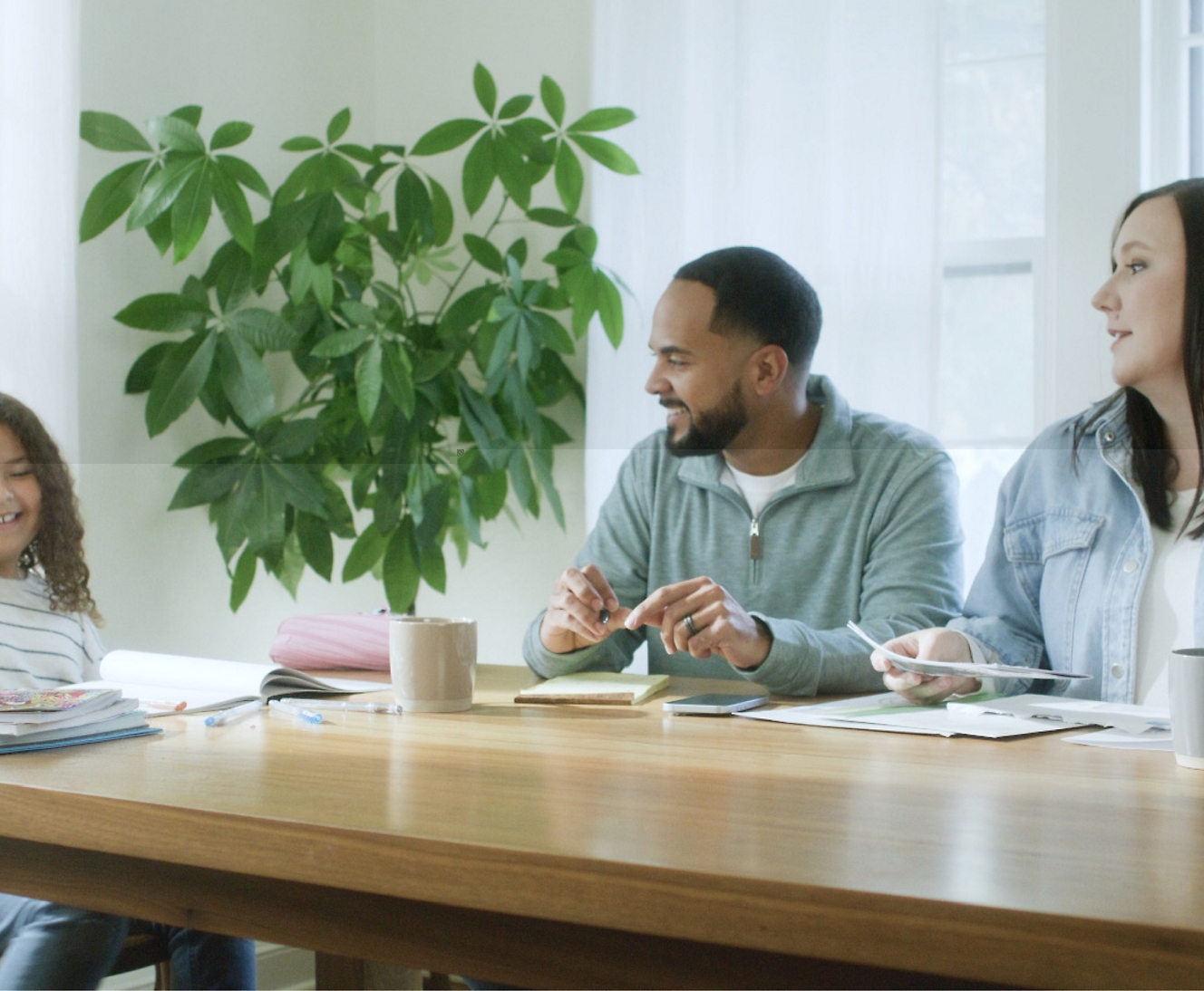 Three people discussing something in smiling face