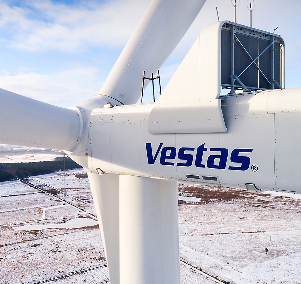 A large white windmill with Vestas in blue writing