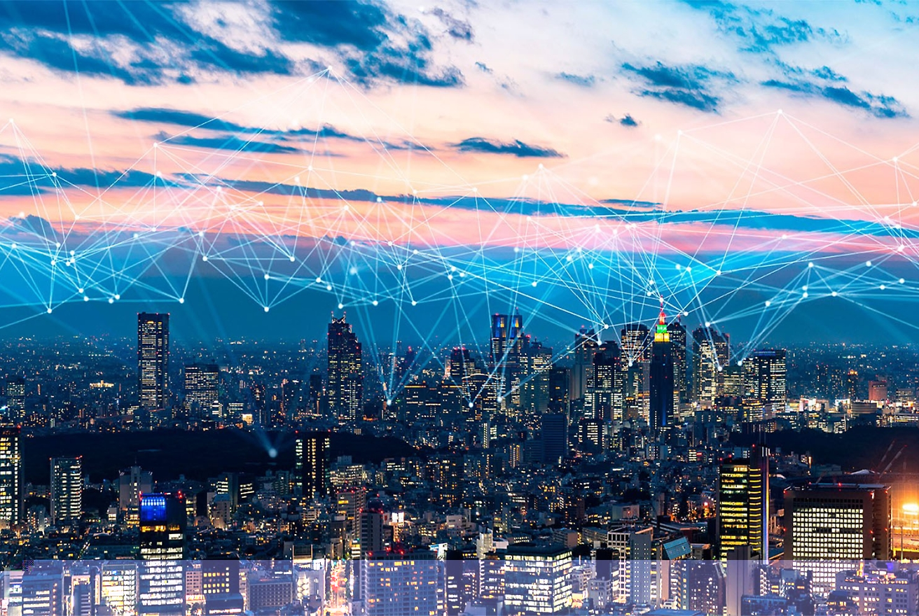 A city skyline at dusk with illuminated buildings and a network of glowing lines connecting different points in the sky above.