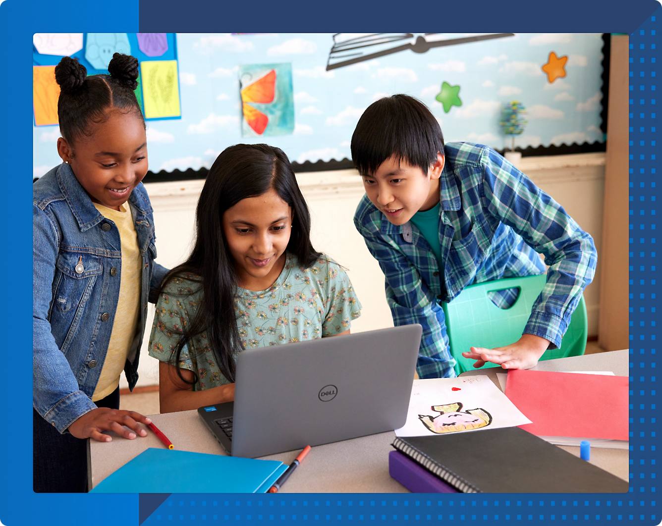 A group of children looking at a computer