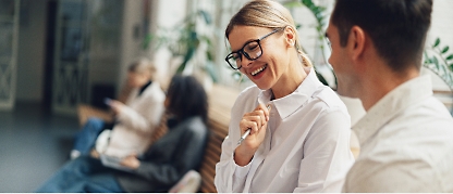 A person smiling with glasses