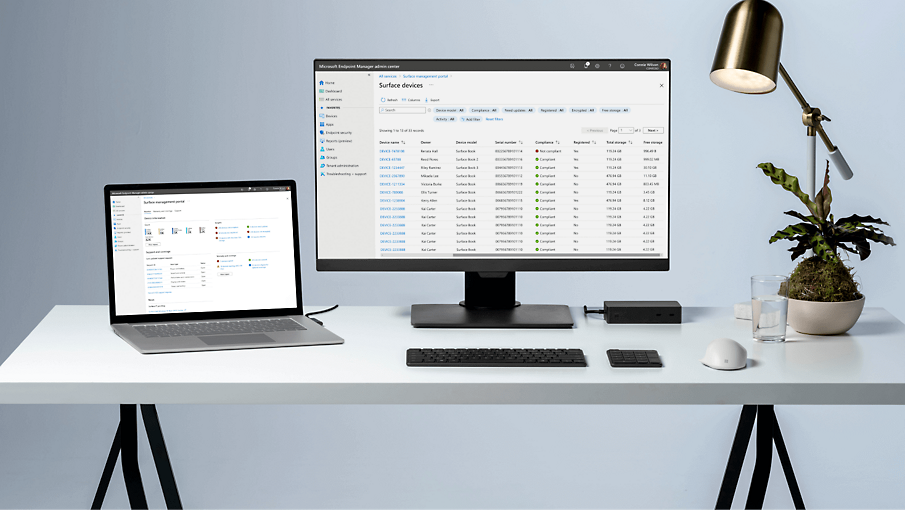 A desk with a laptop connected to a desktop monitor displaying Microsoft Endpoint Manager