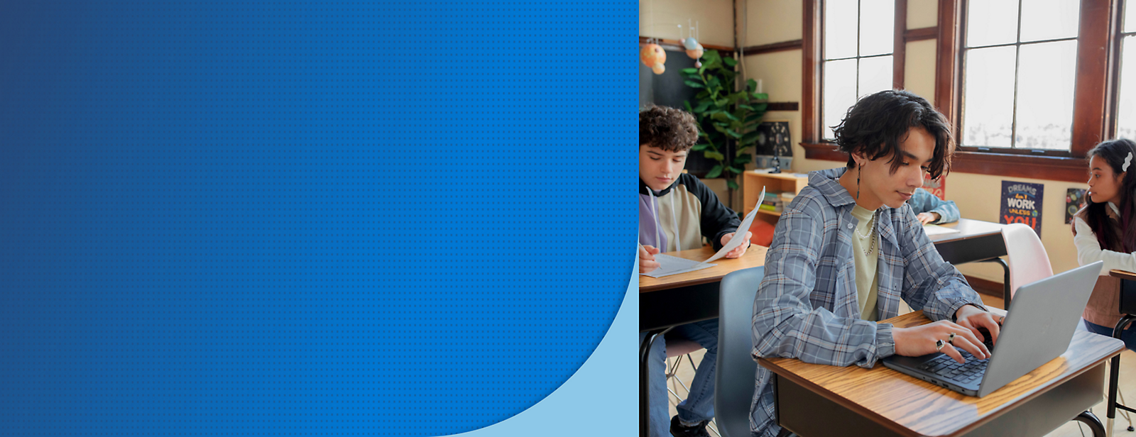 A group of people sitting at a desk