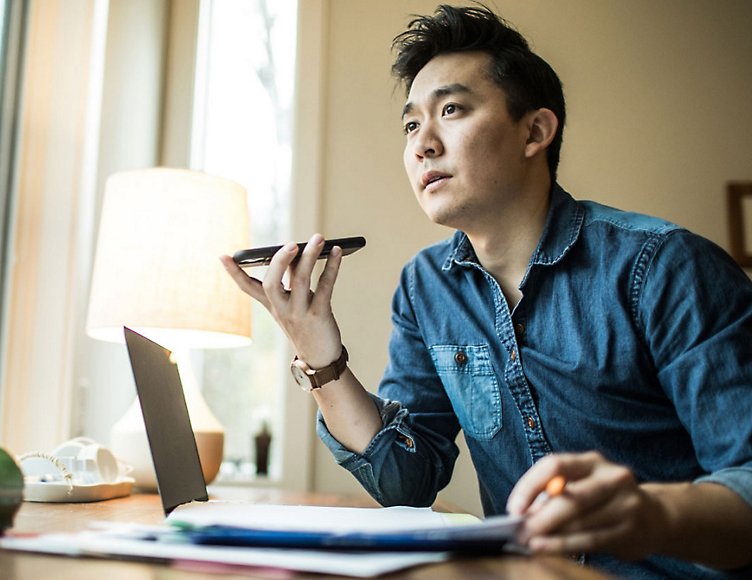 A man discusses financial management over the phone