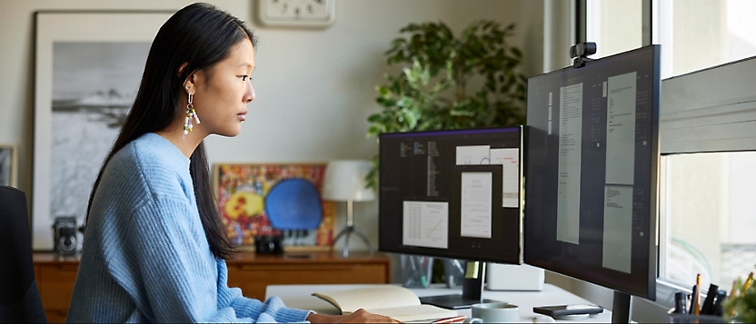 A person looking at a computer screen.